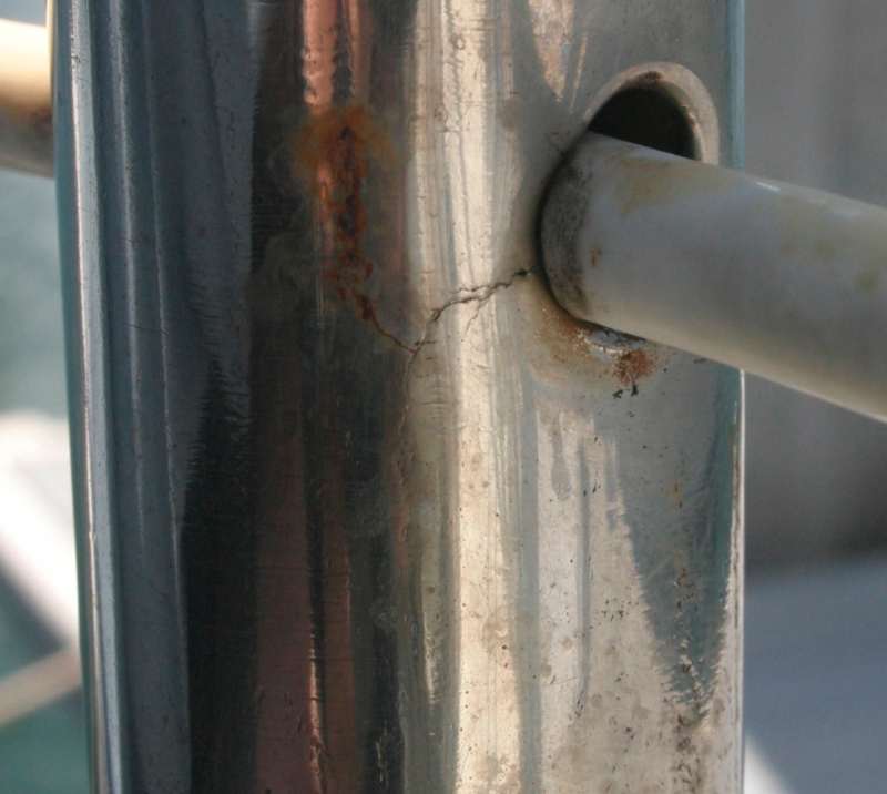 Crevice corrosion cracks in stanchion around lifeline hole
